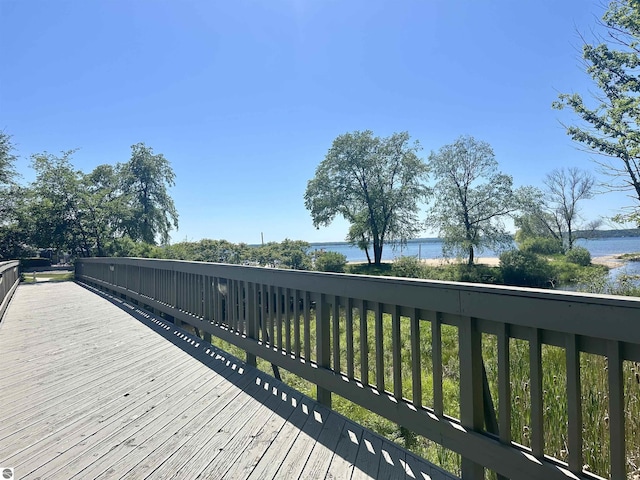 wooden terrace with a water view