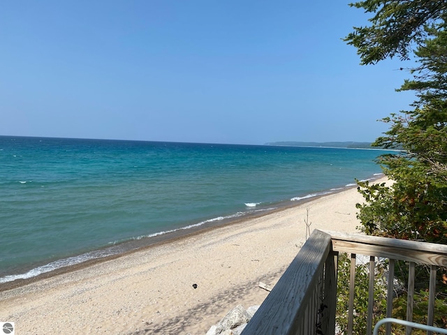 view of water feature with a beach view