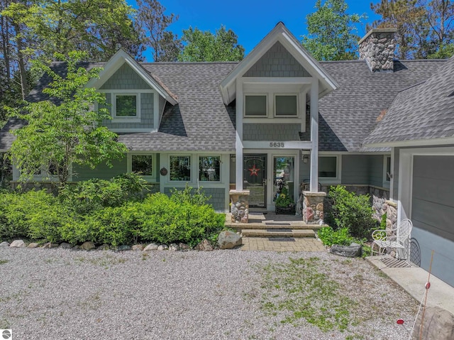 craftsman inspired home with a garage