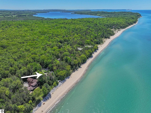 drone / aerial view featuring a view of the beach and a water view