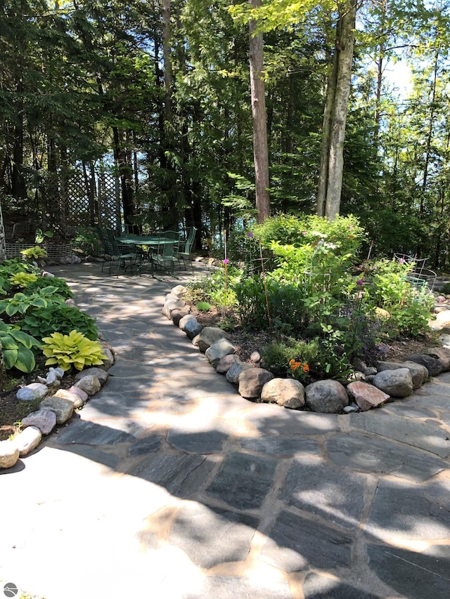 view of home's community with a patio