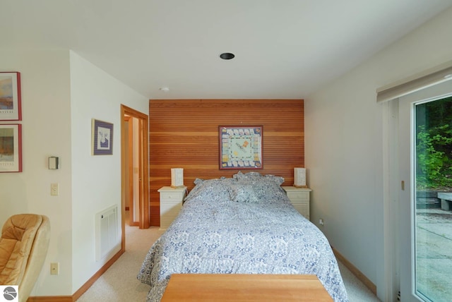 bedroom featuring carpet flooring and access to exterior