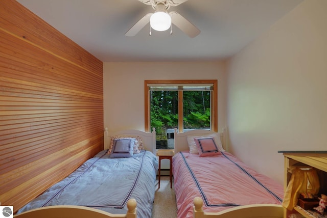 bedroom with ceiling fan and carpet floors