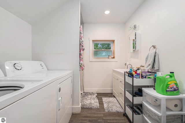 laundry area featuring separate washer and dryer and dark wood-type flooring