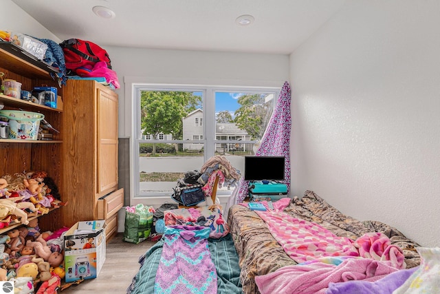 bedroom featuring light wood-type flooring