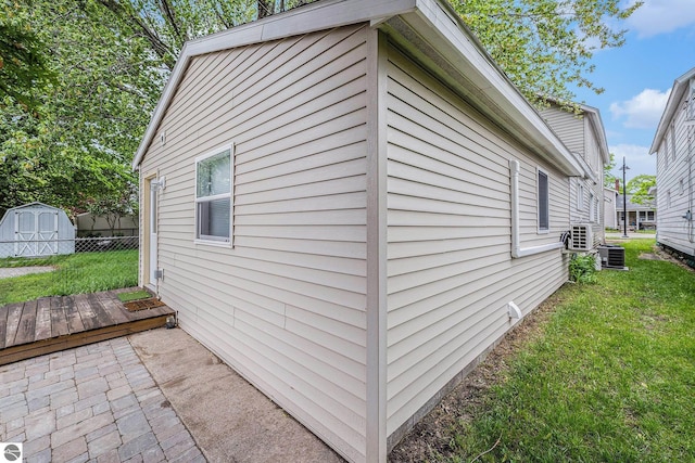 view of side of home featuring a yard