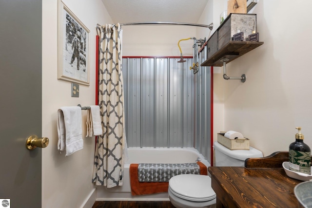 bathroom featuring hardwood / wood-style floors, a textured ceiling, toilet, and shower / tub combo