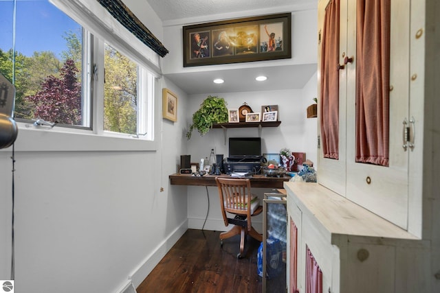 office space with a textured ceiling and dark wood-type flooring