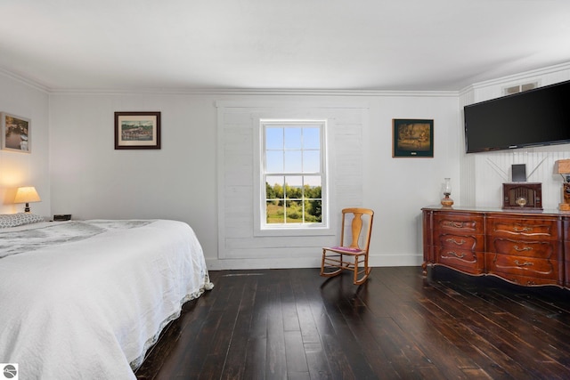 bedroom with hardwood / wood-style flooring and crown molding