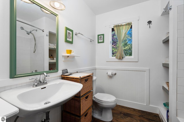 bathroom with sink, toilet, and hardwood / wood-style floors