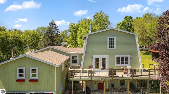 rear view of house featuring a deck