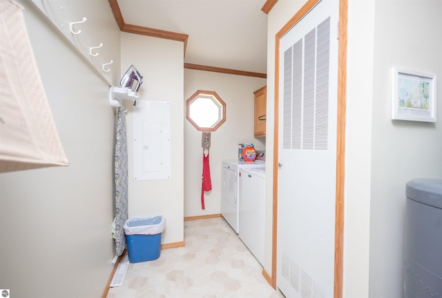 laundry room with cabinets, electric panel, washer and dryer, and ornamental molding