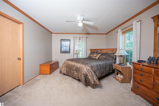 bedroom with light carpet, ceiling fan, and crown molding