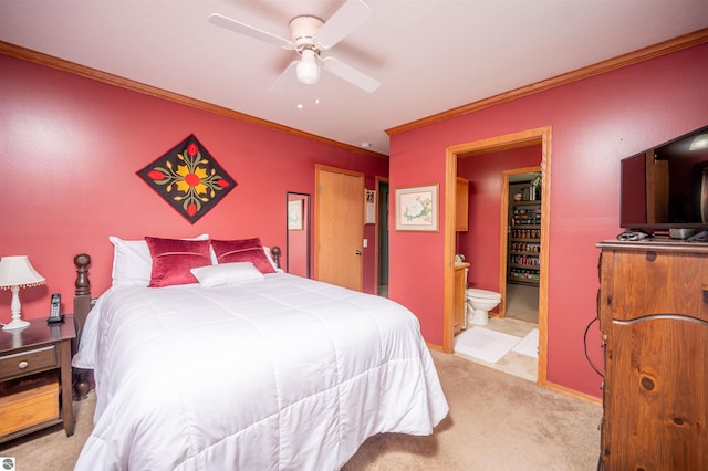 bedroom featuring ceiling fan, crown molding, connected bathroom, and light carpet