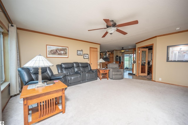 carpeted living room with ceiling fan and crown molding