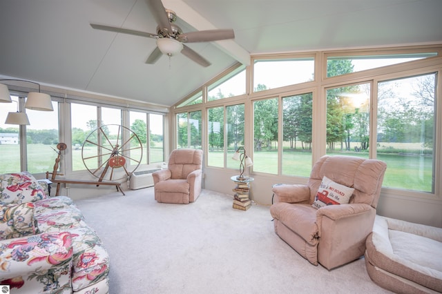 sunroom with lofted ceiling with beams and ceiling fan