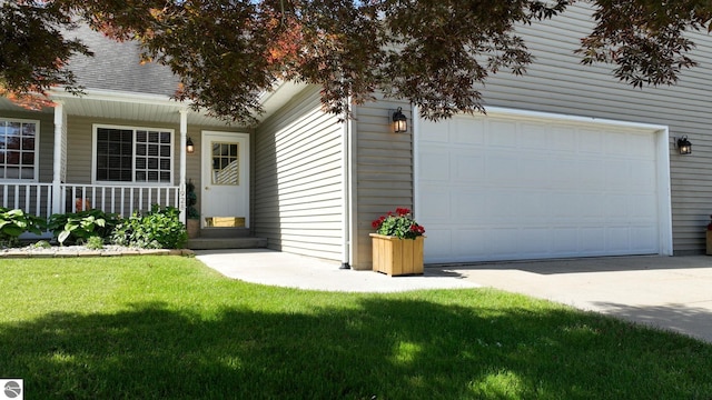 view of front of home featuring a garage and a front lawn