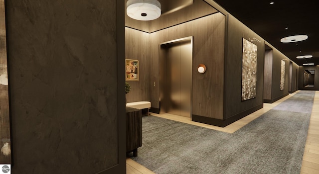 207 W Grandview Unit 404, Traverse City, MI 49684 - hallway featuring elevator and light wood-type flooring