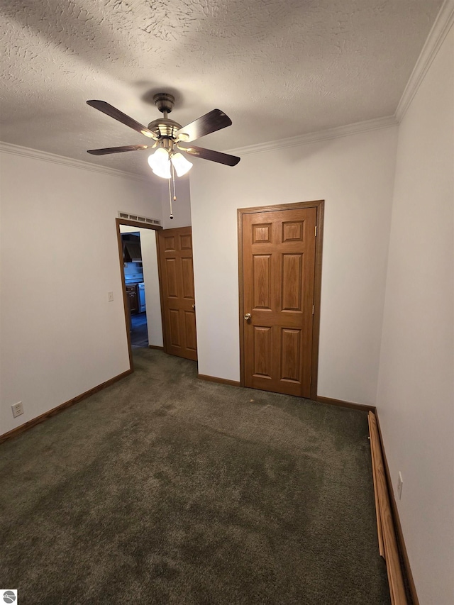 unfurnished bedroom with crown molding, a textured ceiling, ceiling fan, and dark carpet