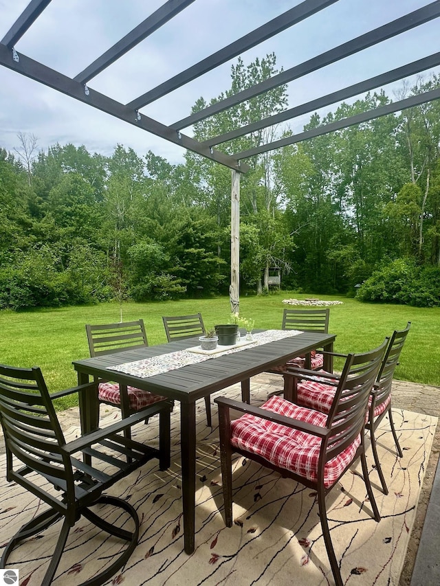 exterior space featuring a yard and a pergola