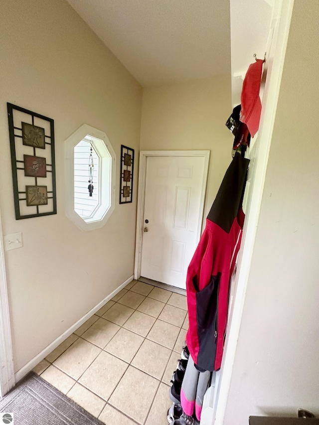 entryway with light tile patterned flooring