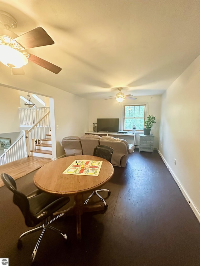 dining room featuring ceiling fan and dark hardwood / wood-style flooring