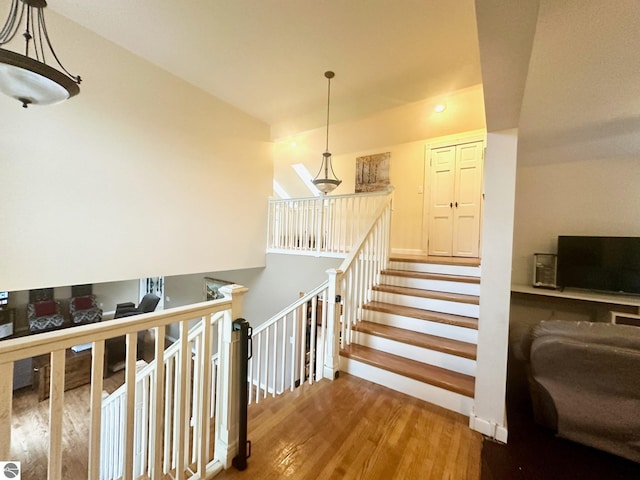 stairway featuring hardwood / wood-style floors