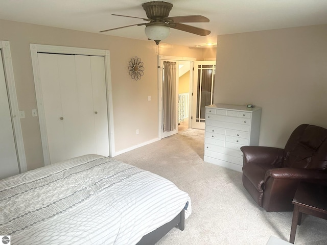 carpeted bedroom featuring ceiling fan and a closet