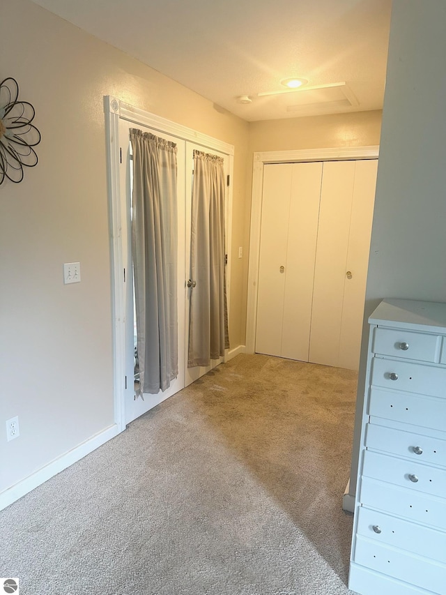 unfurnished bedroom with carpet flooring and a closet