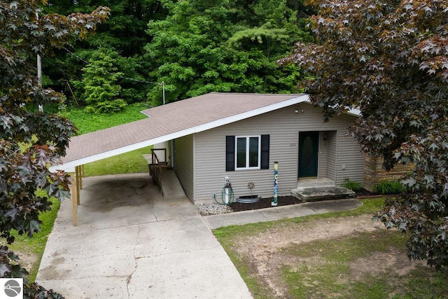 view of front of home with a carport