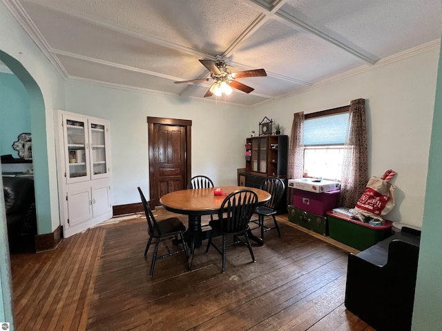 dining space featuring ceiling fan and dark wood-type flooring