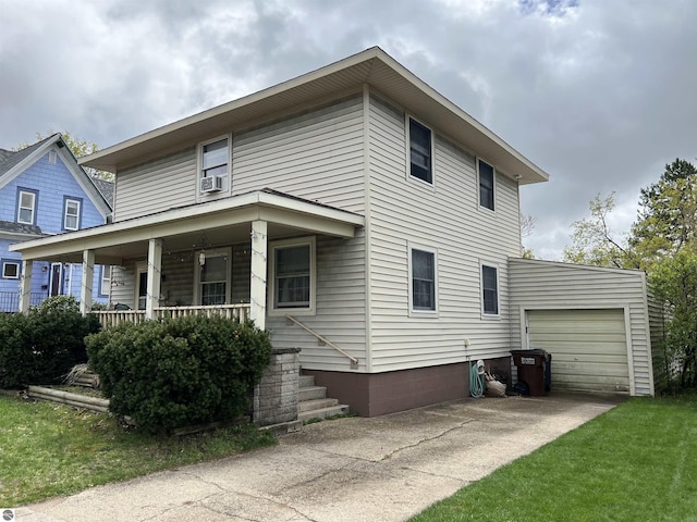 view of front of house featuring covered porch and a garage