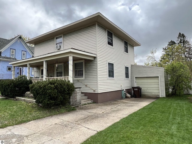 view of front of home with covered porch, a garage, and a front lawn