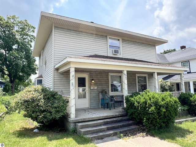 view of front of house with cooling unit and covered porch