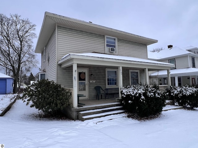 view of front of home with a porch and cooling unit