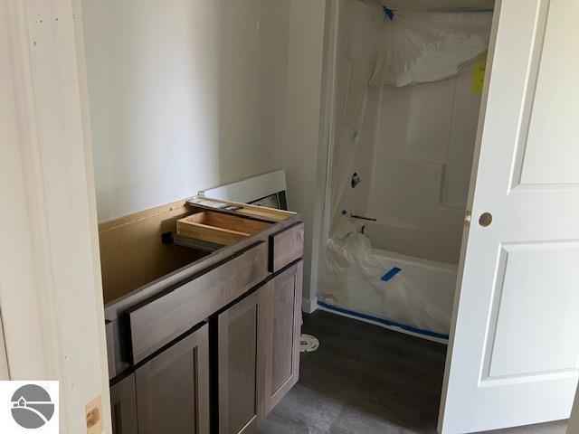 bathroom featuring vanity and washtub / shower combination