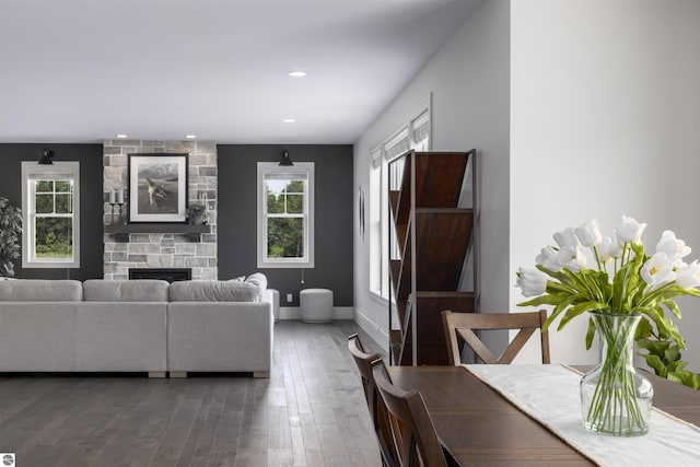 living room with hardwood / wood-style floors and a fireplace