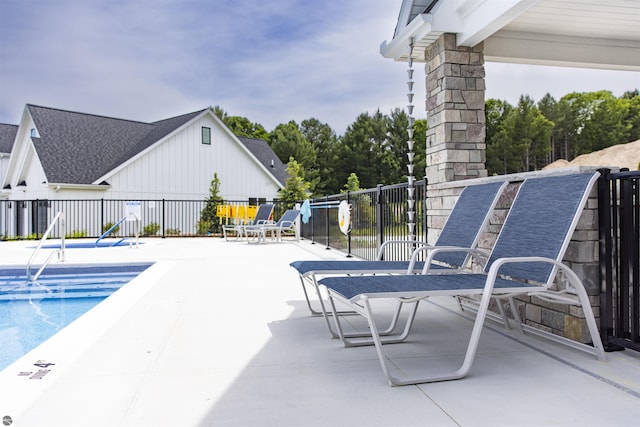 view of swimming pool featuring a patio area