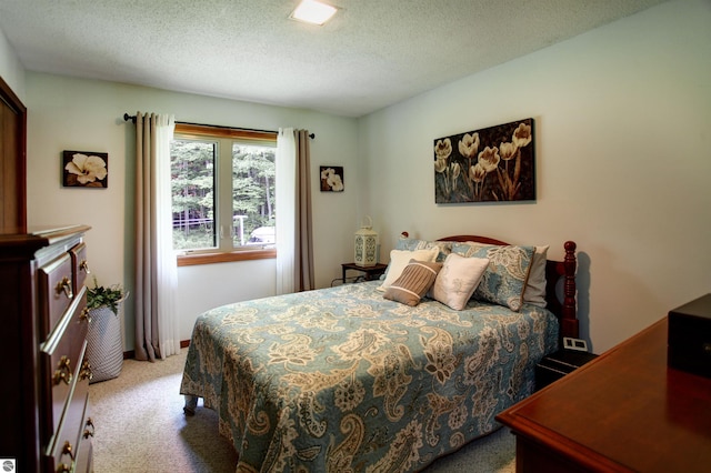 carpeted bedroom with a textured ceiling