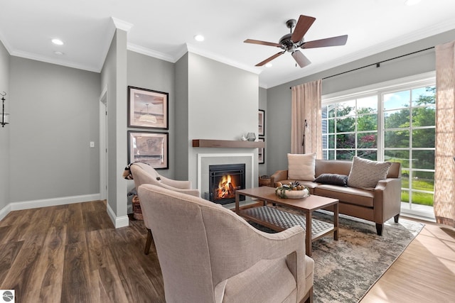 living room with ceiling fan, ornamental molding, and hardwood / wood-style floors