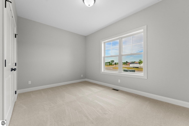 view of carpeted spare room