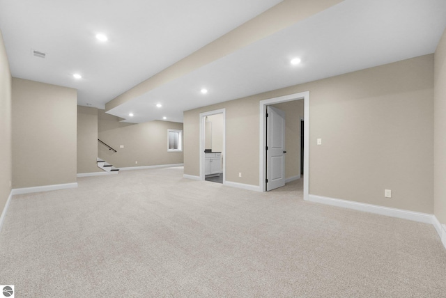 basement with light colored carpet