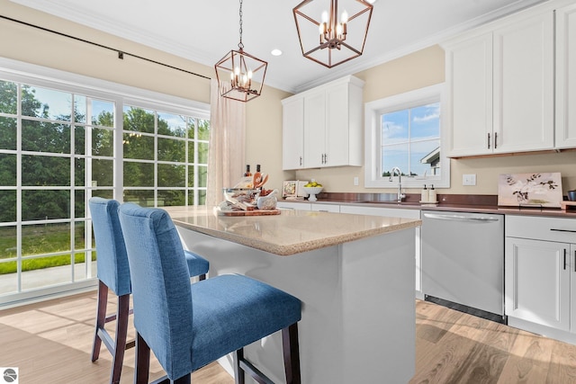 kitchen featuring white cabinetry, dark stone countertops, hanging light fixtures, a chandelier, and stainless steel dishwasher