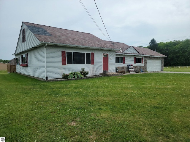 single story home with a front lawn and a garage