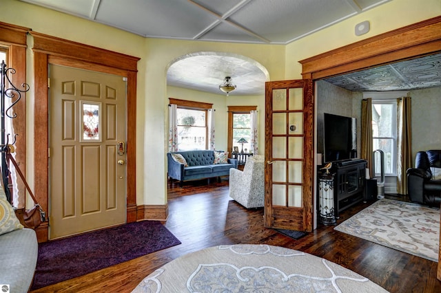 entryway featuring dark hardwood / wood-style flooring and french doors