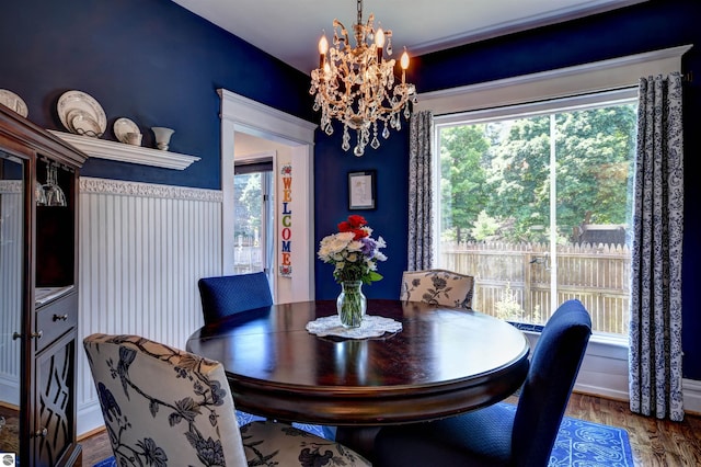 dining room with a chandelier and hardwood / wood-style floors