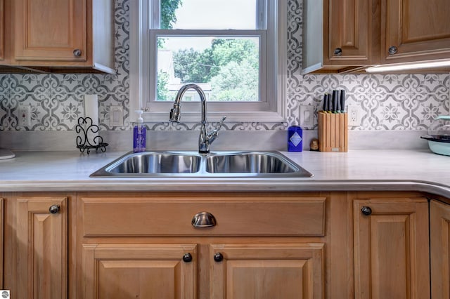 kitchen with tasteful backsplash and sink