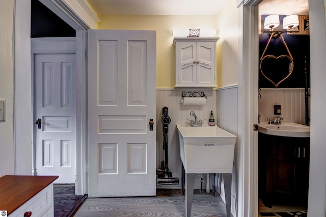 interior space with vanity and hardwood / wood-style flooring