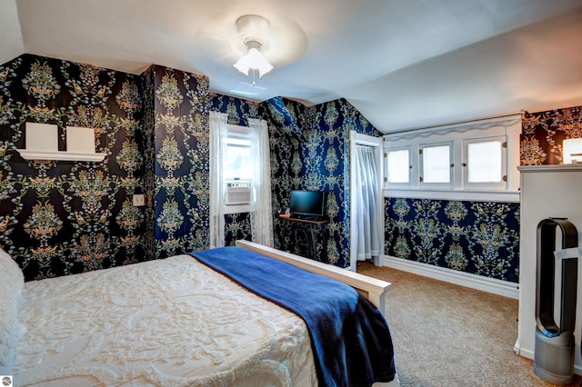 bedroom featuring lofted ceiling, carpet floors, ceiling fan, and cooling unit