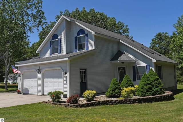 view of front of house with a garage and a front yard